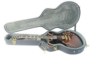 1999 Epiphone Sheraton Guitar, serial #599035330, Vintage Sunburst, semi-hollow, pearl inlay, original hard-shell case, length 40 1/2 inches.