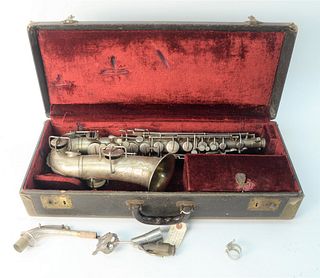 1922 Buescher Alto Saxophone, serial #99783, pads and springs in good shape, Trutone c-melody, hard-shell case, length 25 1/2 inches.