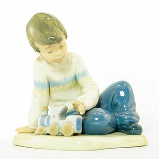 Lladro Nao Figurine, Boy With Toy Train