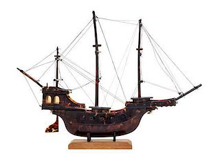 A Hand Carved Tortoise Shell Model of a Ship Width 13 3/4 inches.