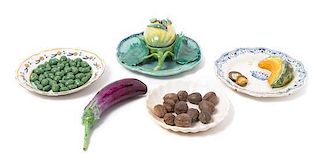 * A Group of Continental Tin-Glazed Earthenware Tromp L'Oeil Vegetables Diameter of largest plate 9 1/2 inches.