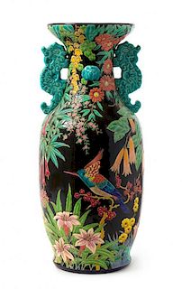* A French Faience Twin-Handled Floor Vase Height 23 3/4 inches.