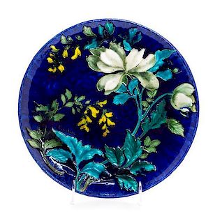 A French Enameled Earthenware Charger Diameter 10 1/8 inches.