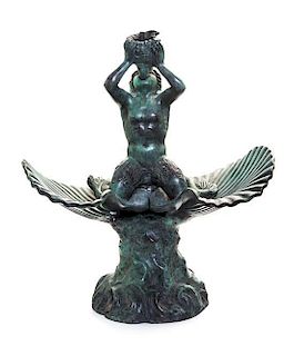 * A Neoclassical Patinated Bronze Fountainhead Height 11 inches.