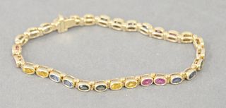 14 Karat Ladies Bracelet, having colored stones. 11 grams. 