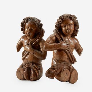 Two Continental Carved Walnut or Limewood Putti, 17th century