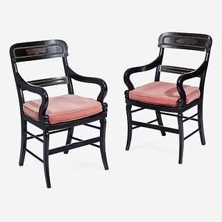 A Pair of Regency Ebonized and Parcel-Gilt Armchairs with Caned Seats, Early 19th century