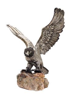 * An Italian Silver Model of an Eagle, Manner of Buccellati, Florence, 20th Century, with outstretched wings, on a rock base.