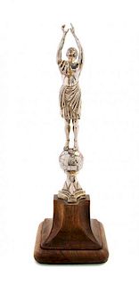 * A George V Silver Ornament, Omar Ramsden, London, 1930, in the form of a classical robed gentleman with arms outstretched over