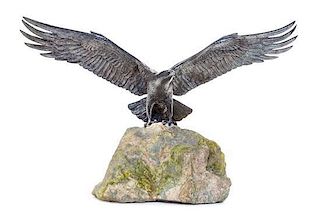 An English Silver Model of an Eagle, Asprey & Co., London, 1977, with spreading wings, on a stone base.