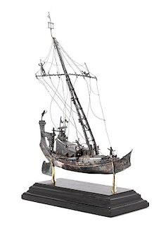 * A Silver Model of a Chinese Junk, , applied with figures and realistic riggings, raised on a stepped base.