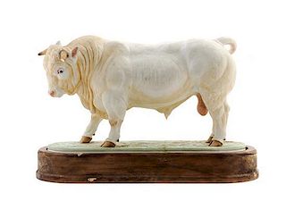 * A Royal Worcester Porcelain Model of a Bull Width overall 11 inches.