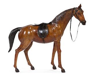 * A Tooled and Painted Leather Model of a Horse Height 37 inches.