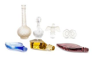 * A Collection of Perfume Bottles and Stoppers Height of tallest 6 1/2 inches.