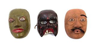 * Three Painted Wood Masks Height of largest 7 3/4 inches.