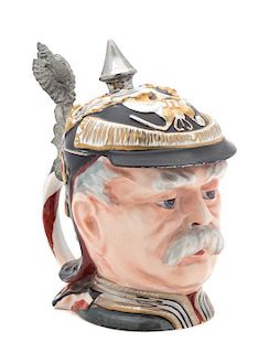 * A German Pewter Mounted Porcelain Figural Stein Height 7 1/4 inches.