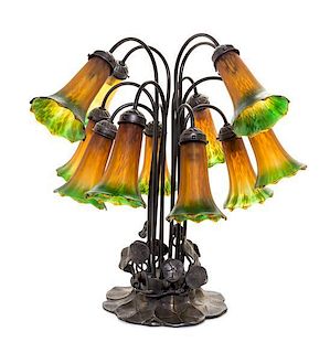 * A Bronzed Metal and Glass Twelve-Light Tulip Lamp Height 21 inches.