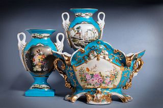 Lot consisting of three porcelain objects: large centerpiece and pair of two-handled vases, 20th century