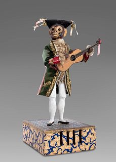 Ancient automaton with a monkey playing the guitar