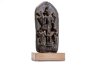 Schist stele depicting Vishnu with his two consorts Lakshmi and Saravastri, India Pala period, 11th - 12th century
