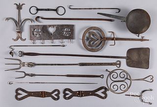 Group of mostly wrought iron hearth equipment.