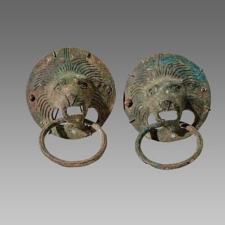 A pair of ancient Roman Bronze Lion Head Handles c.2nd century AD. 