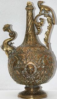 A profusely decorated brass Indian ewer , with floral motifs ,
