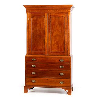 A Late Chippendale Carved and Figured Cherrywood Linen Press, Mid-Atlantic States, Circa 1795 and later