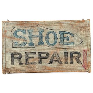 A Wooden Shoe Repair Sign in Old Paint 