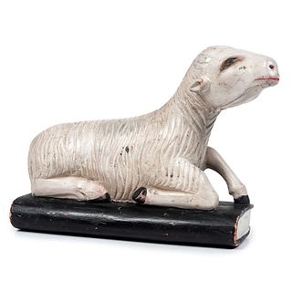 A Folk Art Carved Wooden Lamb on Book