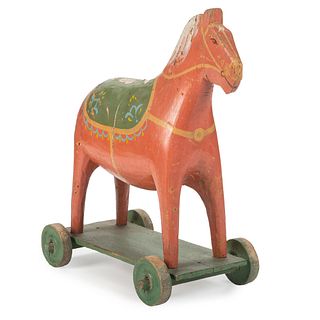 A Folk Art Carved and Painted Wooden Horse Pull Toy 
