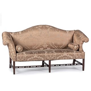 A Chippendale Style Carved Mahogany Camel Back Sofa with Bolsters