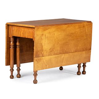 A Classical Tiger Maple and Cherrywood Drop Leaf Dining Table, New England, Circa 1840 