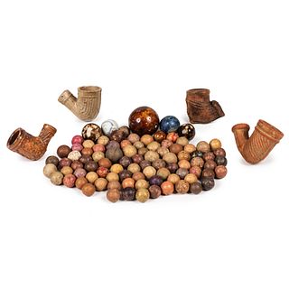 A Collection of Painted Clay Marbles and Pipes