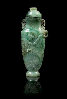 A Chinese Jadeite Covered Vase LATE 19TH/EARLY 20TH CENTURY Height 6 7/8 x width 2 3/4 inches (with cover).