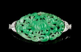 A Jadeite, White Gold and Diamond Brooch CIRCA 1920 Width 2 inches.