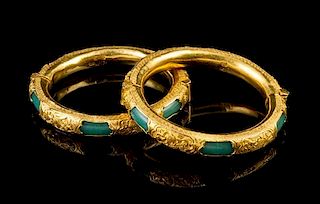 A Matched Pair of Chinese Gold Mounted Green Glass Bangles LATE QING DYNASTY Diameter: 2 inches.