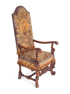 A Louis XIV Style Needlepoint-Upholstered Walnut Armchair
Height 51 x width 24 x depth 23 inches.