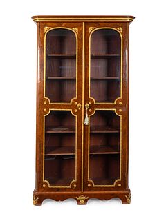 A Regence Gilt-Bronze-Mounted Palisandre Bibliotheque
Height 86 x width 45 x depth 15 inches.