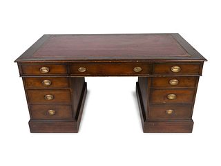 A George III Style Mahogany Partner's Desk
Height 30 1/2 x length 62 3/4 x depth 34 /2 inches.