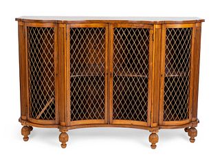A Regency Style Brass-Mounted Faded Rosewood Credenza
Height 37 x length 54 1/4 x depth 18 1/4 inches.