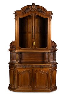 A Victorian Style Carved Walnut Buffet Ã  Deux Corps
Height 125 x width 80 x depth 24 1/4 inches.