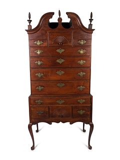 A Queen Anne Style Carved Cherrywood Highboy
Height 67 1/4 x width 37 1/2 x depth 24 1/4 inches.