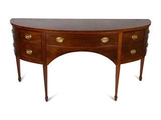 A Federal Style Satinwood-Inlaid Mahogany Bow-Front Sideboard
Height 36 x length 73 x depth 26 inches.