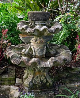 A Carved Stone Two Tier Shell Water Fountain
Height 54 x diameter 51 inches.