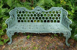 A Green-Painted Cast-Iron Garden Bench and Pair of Armchairs
Bench, height 31 1/2 x width 60 x depth 17 inches; chairs height 31 1/2 x width 27 x dept