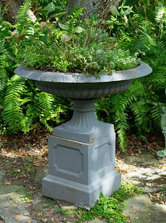 A Pair of Cast Iron Shallow Campana-form Jardinieres on Pedestal Bases
Height 38 x diameter 37 inches.