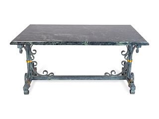 An Italian Baroque Style Parcel-Gilt Wrought- Iron Trestle Table
Height 30 x length 60 x depth 36 1/2 inches.