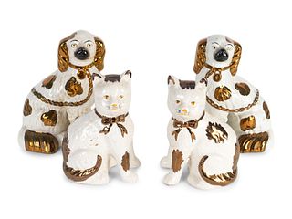A Pair of Staffordshire Copper Lustre and Glazed Earthenware Spaniels and a Pair of Cats
Heights 9 and 8 inches.