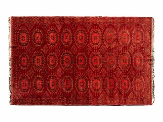 A Bokhara Wool Rug
9 feet 4 inches x 5 feet 11 inches.